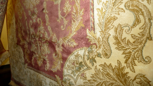 An Aubusson design rug the rose coloured field with gold leafy border 230cm x 150cm