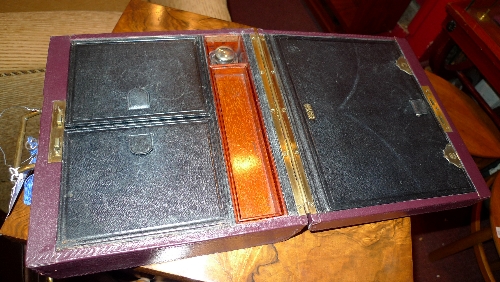 A gentlemans leather clad writing box with fitted interior