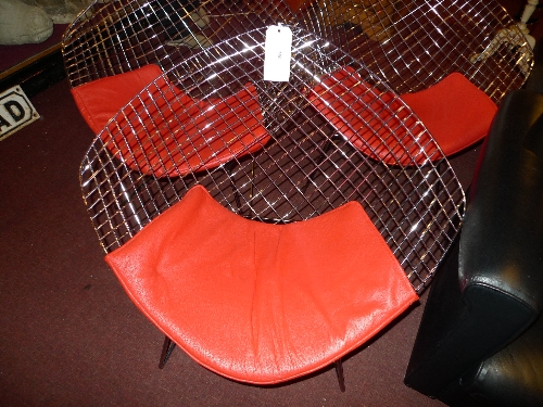 An Italian designer chair with wire mesh back above leather seat