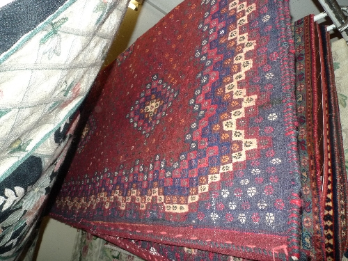 A fine North East Persian Sumak Kilim rug with repeating Buteh motifs on a charcoal field to a