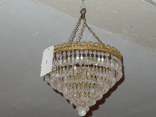 A pair of cut glass hanging chandeliers of cascading form