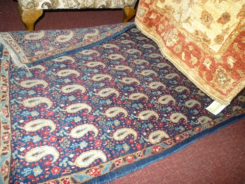A hand knotted Persian Kerma rug the multi coloured field with pattern decoration