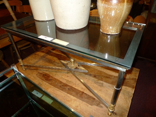 A Romanesque wrought iron and gilt metal low table with plate glass top