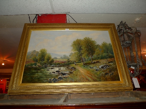 An oil on canvas rocky stream scene with figures beside in gilt frame