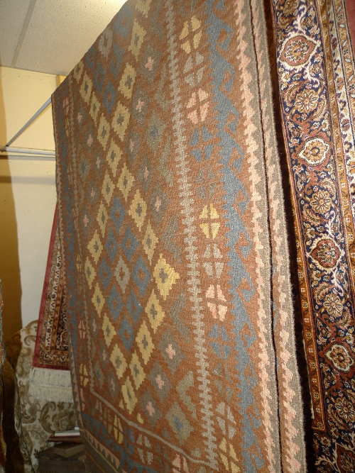 A hand knotted Persian Kelim runner the red field with geometric design