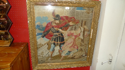 A C19th needlepoint panel depicting a figural scene in a gilt frame