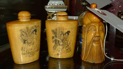 A Chinese snuff box in the form of a scholars head and a pair of simialr perfume bottles with images