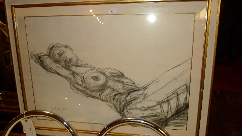 A charcoal study of a reclining female nude signed Juliet Cardley 2000