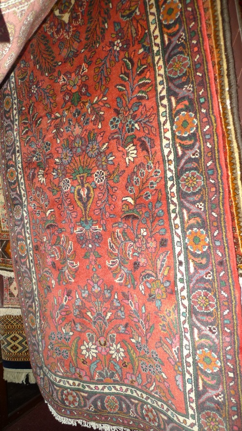 A fine North West Persian Sarouk runner 288 cm x 85 cm central floral medallion on an all over