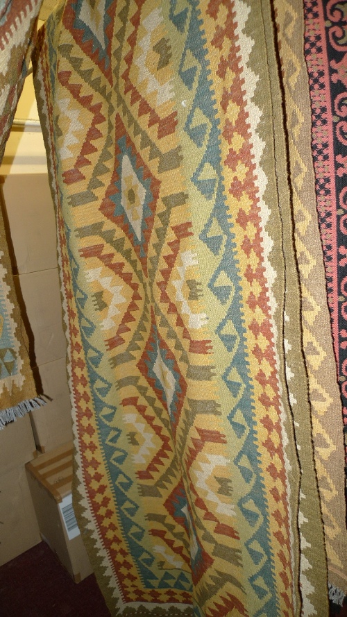 A hand knotted Persian Kelim runner the multicoloured field with geometric design