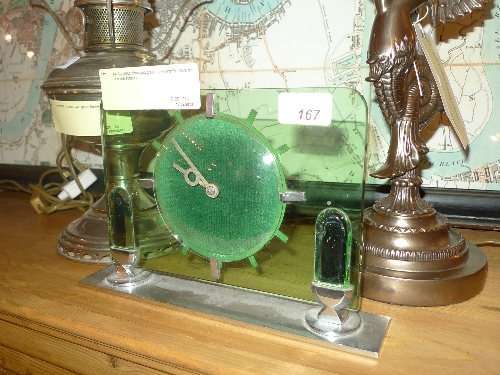 An Art Deco clear and green glass mantle clock on chrome supports