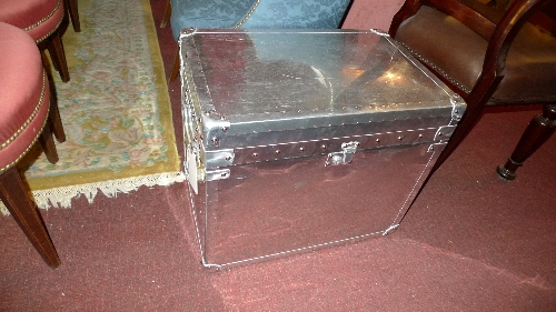 A contemporary polished metal trunk with studded detail