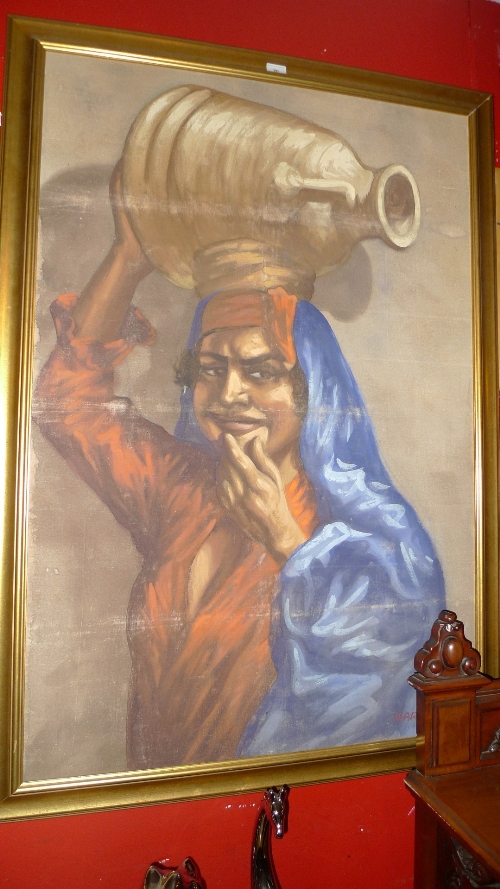 An oil on canvas head and shoulders of an Eastern lady with water pitcher in gilt frame