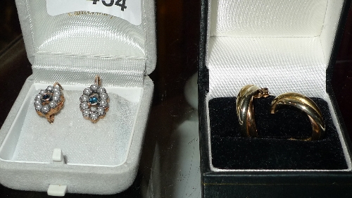 A pair of ladies 9ct gold hoop earrings and a pair of similar inset seed pearl decoration