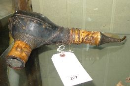 A carved tribal peace pipe