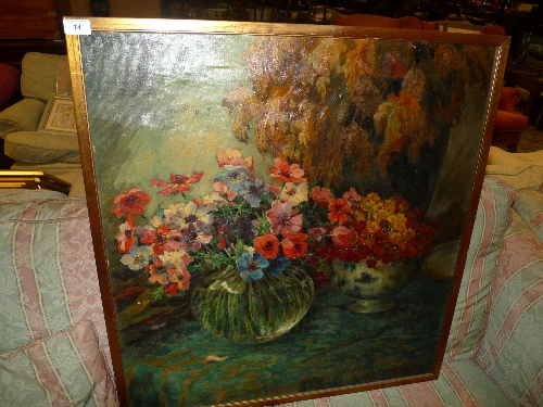 An oil on canvas still life vase of flowers signed L Landot
