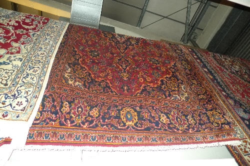 A fine central Persian Kashan rug with pendant medallion with Shah Abbas motifs on a rouge field