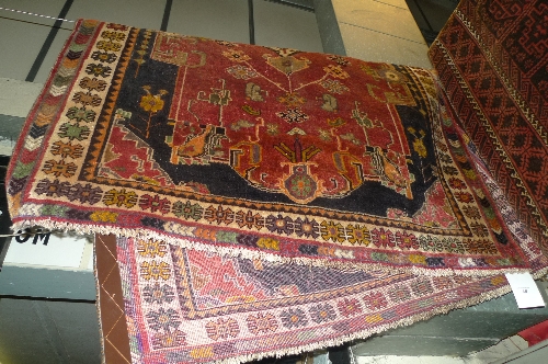 A fine south west Persian Gabeh rug with pendant medallion on a terracotta field within a floral