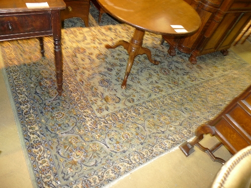 A hand knotted Nain carpet the beige ground with allover stylized foliate decoration