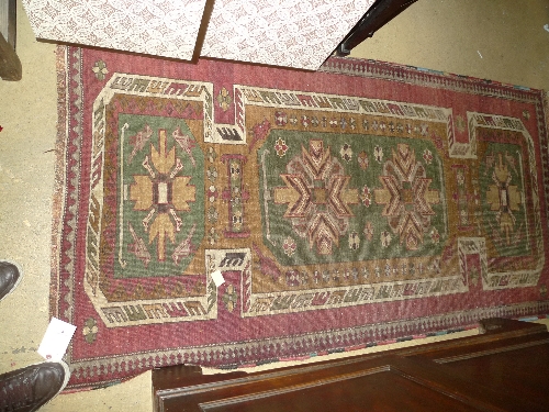 Withdrawn
A hand knotted Persian rug the red ground with stylized decoration