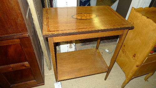 An Edwardian inlaid mahogany side table with conch shell inlaid top united by undertier