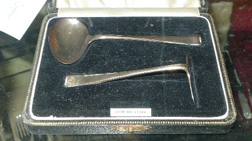 A hallmarked silver christening set comprising spoon and pusher