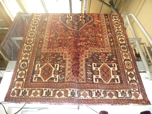 A fine South West Persian Qashgai carpet 2160cm x 162cm pendant diamond medallion on a terracotta