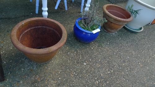 A pair of terracotta planters and others