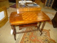 A Victorian walnut chessboard top stretcher table