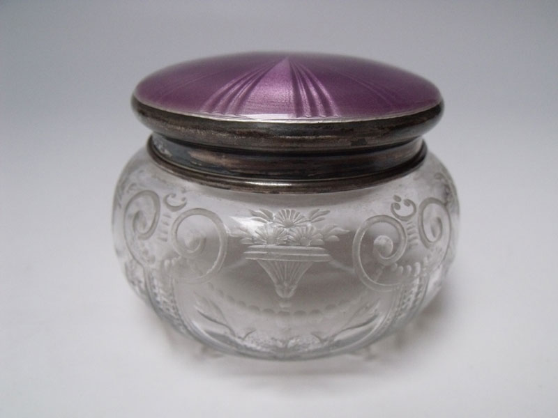 A SILVER AND GUILLOCHE ENAMEL LIDDED DRESSING TABLE POT, Birmingham 1924, engraved glass body with