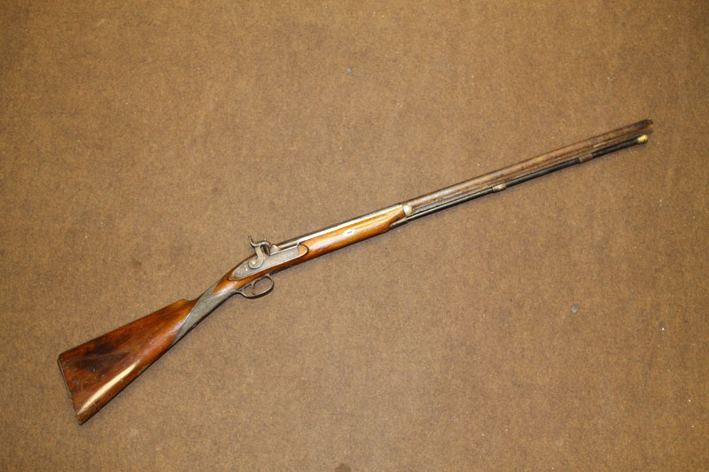 A MID NINETEENTH CENTURY MUZZLE LOADING PERCUSSION FIRE RIFLE, marked "London Fine Twist". L. 116cm.