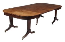 A Regency mahogany and gonçalo alves banded extending dining table, circa 1815, the D shaped end