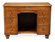 A George IV hardwood campaign combined desk and dressing chest, circa 1825, also called a lavatier,