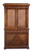 A Regency rosewood secretaire bookcase, circa 1815, the moulded cornice, above a pair of silk