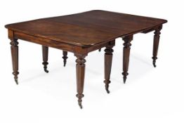 A Victorian mahogany extending dining table, circa 1860, in the manner of Holland & Sons, the