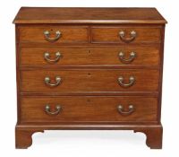 A George III mahogany chest of drawers, circa 1790, the rectangular top with moulded edge above two