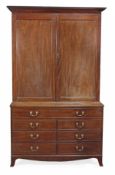 A Regency mahogany cabinet on chest, circa 1815, attributed to Gillows of Lancaster, the moulded