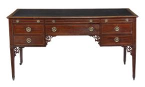 A Regency mahogany and crossbanded partners’ desk, circa 1815, the rectangular top with moulded