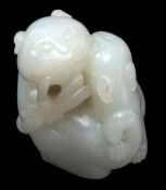 A Chinese jade group of two cats, 18th century , climbing over each other, with small ears, incised