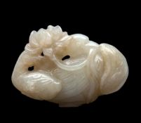 A fine Chinese pale celadon jade carving of a mandarin duck and duckling, 18th century, swimming