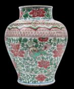 A Chinese Wucai porcelain jar, Shunzhi period , with wide shoulders and waisted neck, the globular