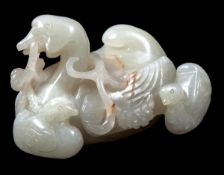 A Chinese jade group of three wild swimming geese, 17th-18th century, the adult holding a spray of