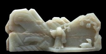 A Chinese jade boulder, 17th-18th century , carved as a laminated moutainous landscape with a