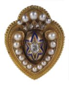 A Victorian diamond and pearl brooch/locket, circa 1880, the heart shaped brooch with a beaded