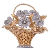 A diamond set giardinetto brooch, circa 1950, the woven basket containing textured leaves and pavé