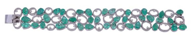 An emerald and diamond bracelet, set with pear cut emeralds, approximately 25.50 carats total, with