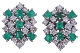 A pair of emerald and diamond ear clips, claw set with brilliant cut diamonds and step cut emeralds