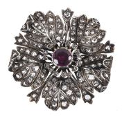 A late 19th century diamond and garnet flower brooch, circa 1880, the petals and stigma set with