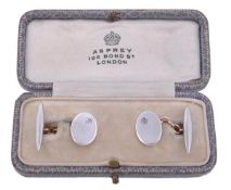 A pair of early 20th century diamond cufflinks, the cufflinks with an oval panel set with an old