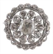 A diamond cluster brooch, the circular brooch set with a central table cut diamond within a